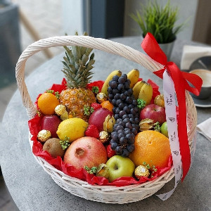 Fruit Basket "Sunny Harvest" with Pineapple and Chocolates with delivery Kemerovo
