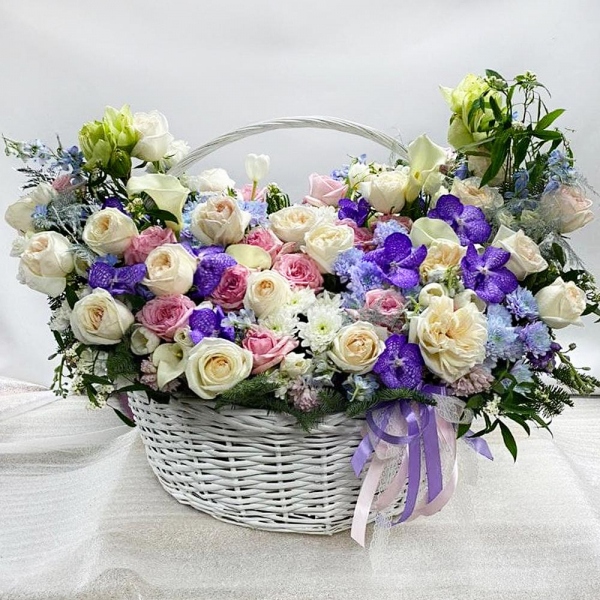 Pink Hyacinth - 13, Calla lilies - 6, Tulip white - 6, White amaryllis  - 3, Vanda Orchid bud - 19, Peony style roses - 30, Chrysanthemum spray Baltica painted blue - 8, lisianthus - 13, Matthiola Lilac - 10, Baltica White Spray Chrysanthemum - 7, Peony rose pink 'OHara' - 30, Huge basket, Oasis, Asparagus setaceus (1 pc.), Waxflower (1 pc.), Blue Delphinium, Flask for orchids, Fern (1 pc.), Spruce branches (1pc.), Ribbon