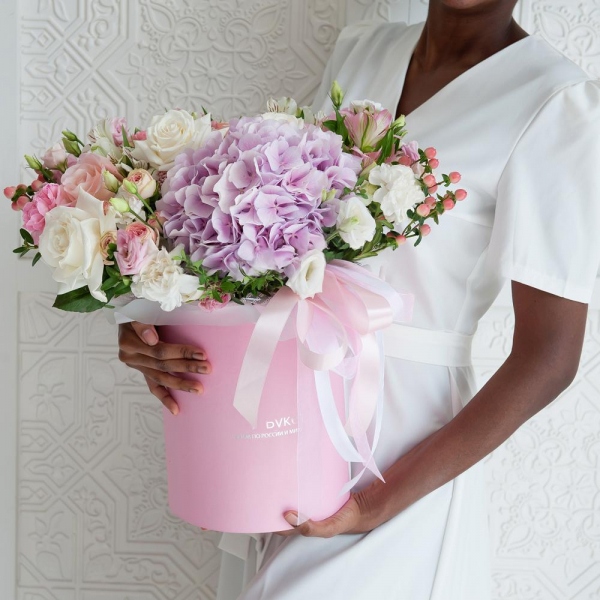 Pink Hydrangea - 1, White rose 50 cm - 4, Pink rose 50 cm - 4, Peony sprayrose - 2, Pink Lisianthus (Eustoma) - 1, Pink carnation - 8, White spray carnation - 4, Alstromeria white, soft pink - 5, Spray rose: white, cream, light pink 50 cm - 2, lisianthus - 1, Round flower box medium, Oasis, Ribbon, Ozotamnus, Hypericum, Pistachio