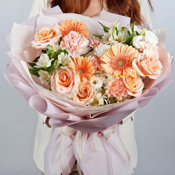 Cream gerbera - 3, Baltica White Spray Chrysanthemum - 2, Carnation white, cream - 15, Pink-orange rose Phoenix 50 cm - 5, Alstromeria white, soft pink - 7, lisianthus - 2, Wrapping Paper