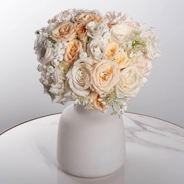 Carnation white, cream - 7, White rose 50 cm Ecuador - 5, Spray rose: white, cream, light pink 50 cm - 2, lisianthus - 4, Gypsophila - 2, Ribbon