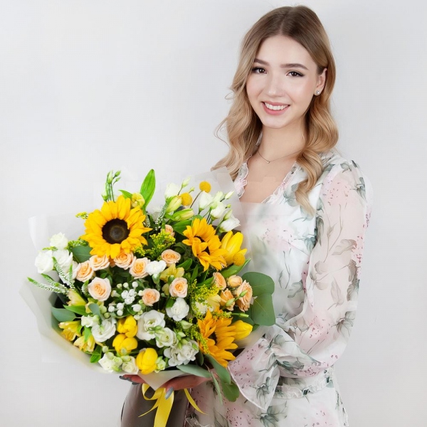 Sunflower - 4, Spray rose: white, cream, light pink 50 cm - 4, lisianthus - 4, Alstromeria Yellow, Orange - 4, Yellow tulip - 7, White spray carnation - 3, Solidago (1 pc.), Veronica spray, Craspedia, Pistachio, Eucalyptus populus (1 pc.),  Bouvardia, Wrapping Paper