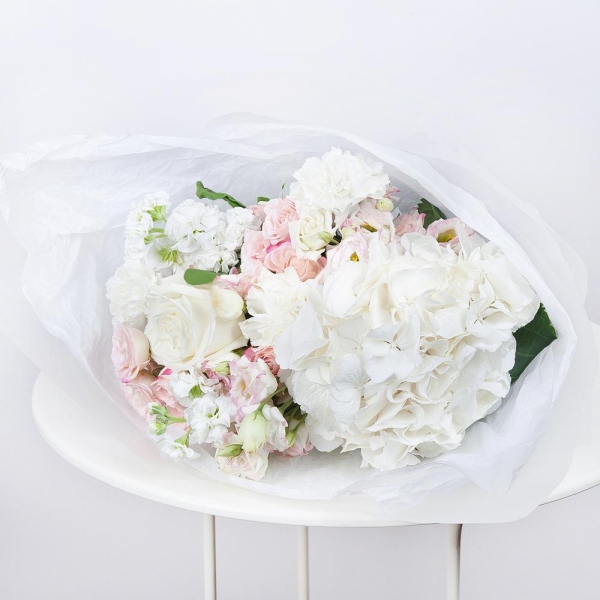  White Hydrangea - 1, Carnation white, cream - 5, Pink Lisianthus (Eustoma) - 3, White rose 50 cm - 3, White Matthiola - 3, Spray rose: white, cream, light pink 50 cm - 3, Wrapping Paper