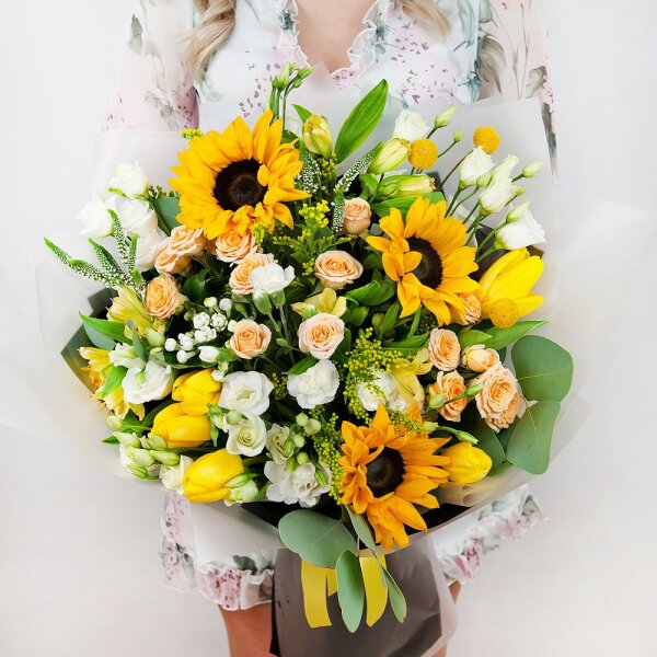 Sunflower - 5, Spray rose: white, cream, light pink 50 cm - 5, lisianthus - 5, Alstromeria Yellow, Orange - 5, Tulip white - 7, White spray carnation - 4, Solidago (1 pc.), Veronica spray, Craspedia, Pistachio, Eucalyptus populus (1 pc.),  Bouvardia, Wrapping Paper, Ribbon