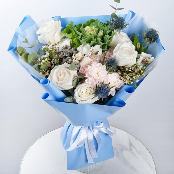 White rose 50 cm - 7, Baltica Pink Spray Chrysanthemum - 2, Alstromeria white, soft pink - 2, Brassica, Eryngium, Brunia Green Lanuginosa (1 pc.), Waxflower (1 pc.), Eucalyptus, Wrapping Paper