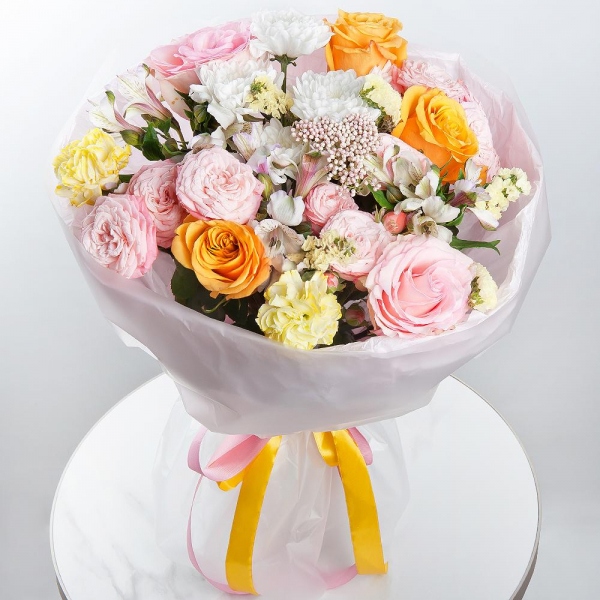 Yellow rose 50 cm - 5, Pink rose 50 cm - 3, Baltica White Spray Chrysanthemum - 2, Peony sprayrose - 3, Alstromeria white, soft pink - 5, Yellow carnation - 4, Yellow Statice, Ozotamnus, Wrapping Paper